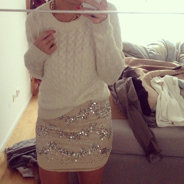 love a casual cozy sweater paired with a shimmery skirt. 